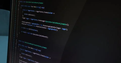 Hacker scrolls program code on notebook computer, cyber security concept Stock Footage 266814320