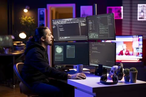Hacker in secret hideout uses ransomware attacks to hold company systems hostage Stock Photos