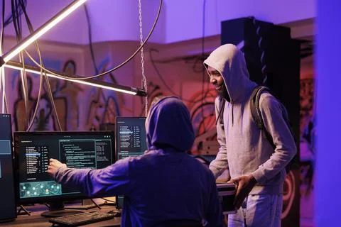 Hacker showing malware code on screen Stock Photos