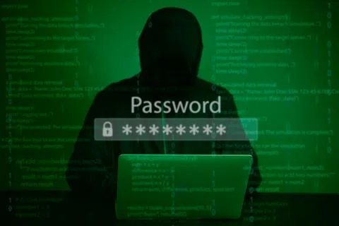 Hacker in silhouette targeting encrypted password data on a digital screen. Foto stock