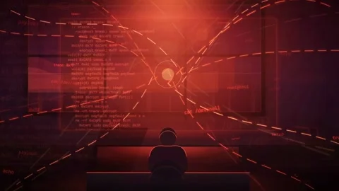 Hacker Silhouette Working at Multiple Computer Monitors with Glowing Red Code 動画素材 341456527