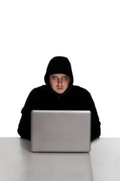 Hacker on silver laptop Stock Photos