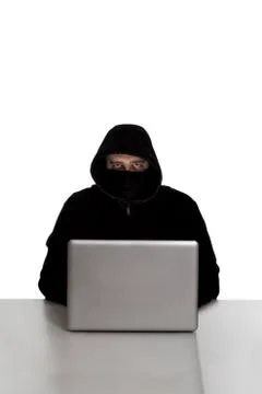 Hacker on silver laptop Stock Photos