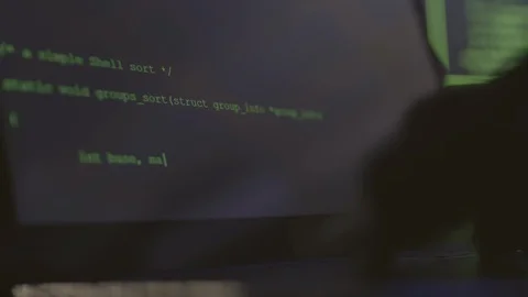 Hacker Sitting in Darkness and Coding Stock Footage 129813063