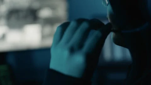 Hacker speaking on headphone using computer breaks into data servers and infects Видео 255199558