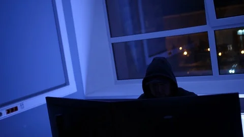 Hacker spy at night in office Stock Footage 86949892