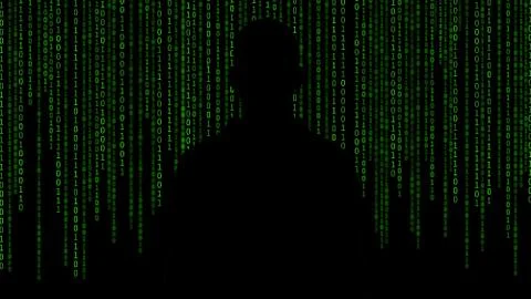 Hacker standing in front of 01 or binary numbers on the computer screen on mo 库存照片