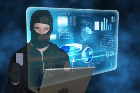 Hacker standing in front of 3D blue interface Stock Photos