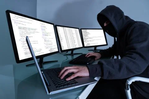 Hacker Stealing Data On Multiple Computers And Laptop 스톡 사진