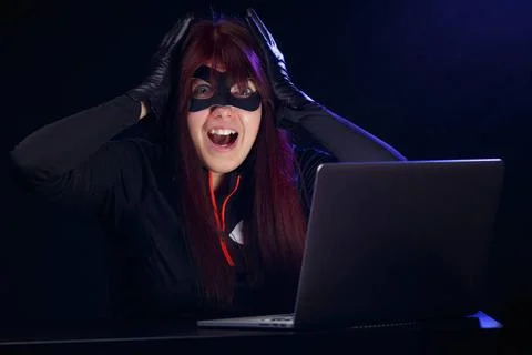 Hacker steals information from computer Hacker steals information from com... Stock-Fotos