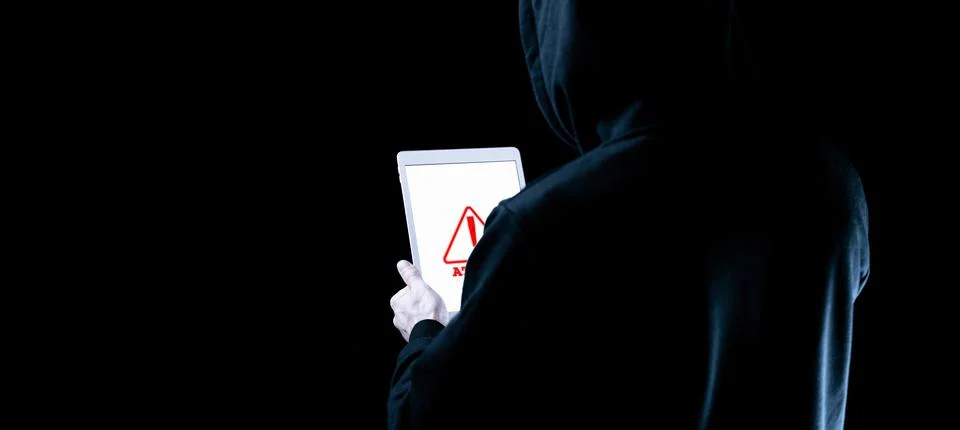 Hacker tablet cyber security. Digital mobile phone in hacker man hand isolate Foto stock