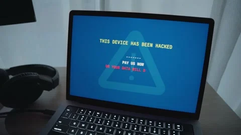 Hacker taking control over laptop displaying ransom message requesting payment Stock Footage 344231583