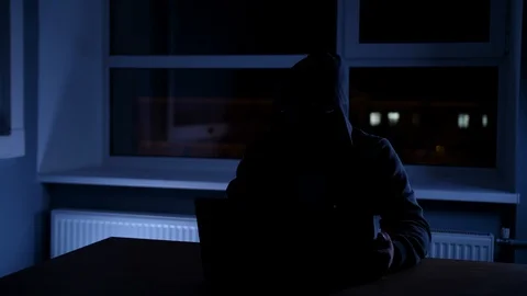 Hacker thief in office Stock Footage 86950023
