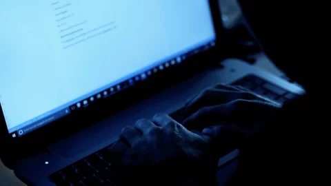 Hacker types quickly on the computer at night Stock Footage 83700115