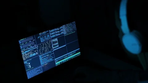 Hacker Typing and Works On A Computer with Data Display Screens Stock Footage 128779509