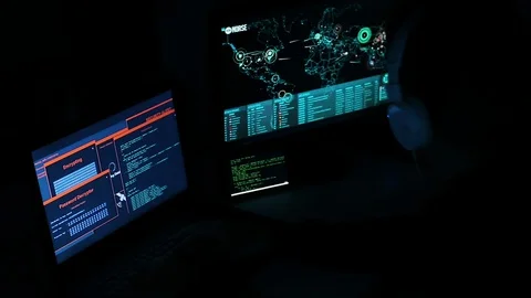Hacker Typing and Works On A Computer with Data Display Screens World Map Stock Footage