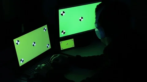 Hacker Typing and Works On A Multiple Screens.Green Screen-Chroma Key Stock Footage 128841887