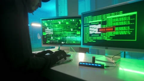 Hacker is typing on a computer keyboard and cracking a password. A man in a Stock Footage 233595163