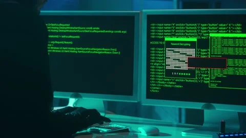 Hacker is typing on a computer keyboard and cracking a password. A man in a Stock Footage 233599420