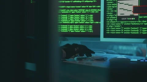 Hacker is typing on a computer keyboard and cracking a password. A man in a Stock Footage 233603653