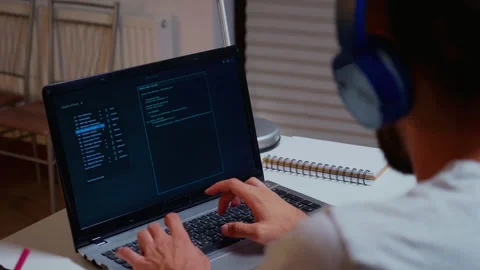 Hacker typing on the computer at night Stock Footage 141524029