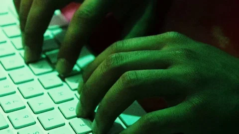 Hacker typing on a keyboard 4K Video stock 94186246