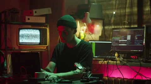 Hacker typing on keyboard at night, breaking password, using laptop and Vídeos de archivo 160154043