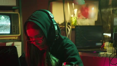Hacker typing on keyboard at night, breaking password, wearing black hood Stock Footage 160268217