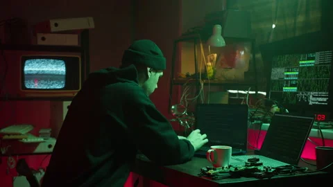 Hacker typing on keyboard at night, breaking password, using laptop and 動画素材 160493434