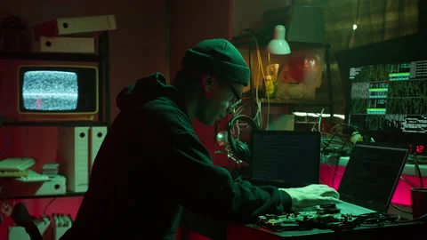 Hacker typing on keyboard at night, breaking password, using laptop and Stock Footage 160941580