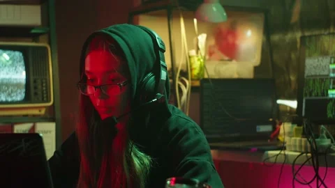 Hacker typing on keyboard at night, breaking password, using laptop and wearing Stock Footage 161177933