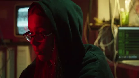 Hacker typing on keyboard at night, thinking how to break password, using Stock-Footage 161177894