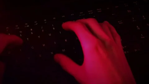Hacker typing on keyboard red danger effect 動画素材 83261914