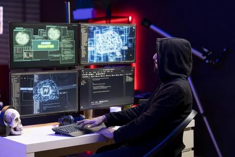 Hacker typing on keyboard, running neural network software to breach security Stock-Fotos