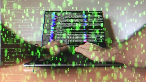 Hacker typing on a laptop with glitching green binary code. Cyber attack Video stock 286073423