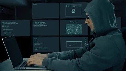 Hacker typing at laptop. Man coding on computer dark night. Man in dark glasses Stock Footage 82824294