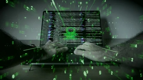 Hacker typing on laptop with skull symbol and green matrix code Stock Footage 286110802