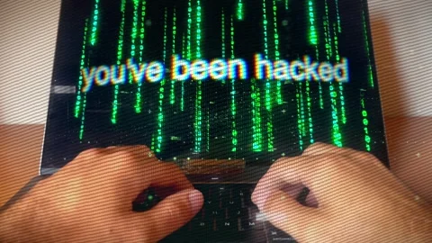 Hacker typing as 'You’ve been hacked' message displays on laptop Stock Footage 286088729