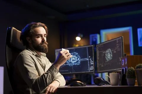 Hacker uploading evolved sentient AI to disk, planning to use it for evil plan 스톡 사진