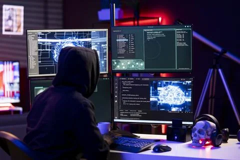 Hacker using artificial intelligence on computer to break into systems 스톡 사진