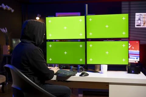 Hacker using chroma key computer to gain unauthorized network access Stock Photos