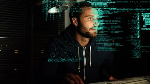 Hacker using a computer and program codes Stock Footage 107687808