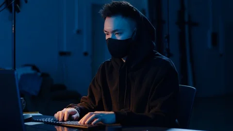 Hacker using computer for cyber attack at night Stock Footage 106141985