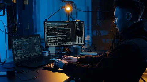 Hacker using computer for cyber attack at night Stock Footage 106524634