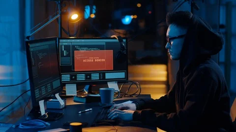 Hacker using computer for cyber attack at night Stock Footage 107769311