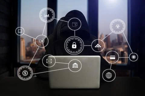 Hacker using computer with digital interface while sitting at desk of blurry Stock Photos