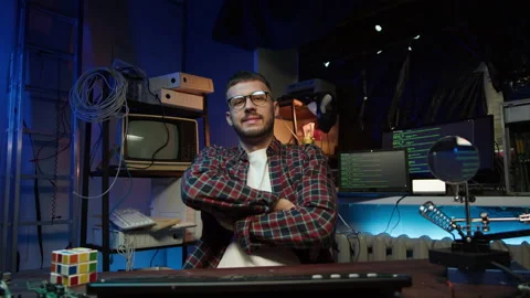 Hacker using computer, looking at monitor screen. Young man developing program Video stock 193807828