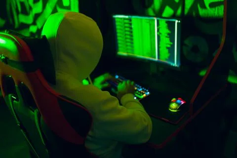 Hacker using computer malware software and hacking binary code digital interface Stock Photos