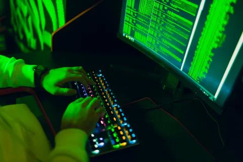 Hacker using computer malware software and hacking binary code digital interface Stock Photos