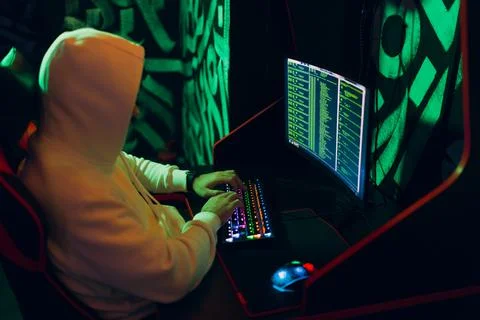 Hacker using computer malware software and hacking binary code digital interface Stock Photos